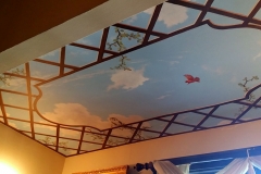 Ceiling. Blue sky and birds