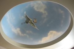 Blue sky ceiling mural. Obstetrician Office. Stork and baby with