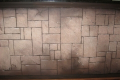 Faux stone wall.